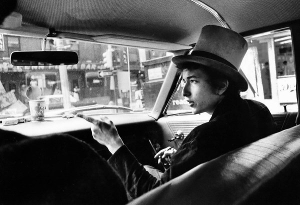 Daniel Kramer, Bob Dylan with Top Hat Pointing in Car, Philadelphia, 1964