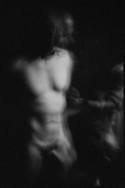 Nude man in dark by Stephen Barker
