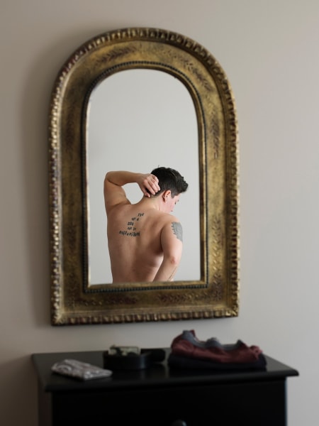 Person in mirror by Jess T. Dugan