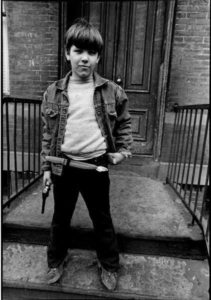 Boy with gun by Len Speier