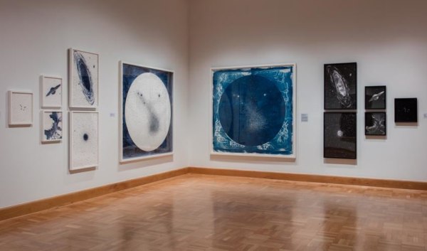 Lia Halloran cyanotypes and drawings hung in a salon style installation in &quot;The Observable Universe&quot; exhibition