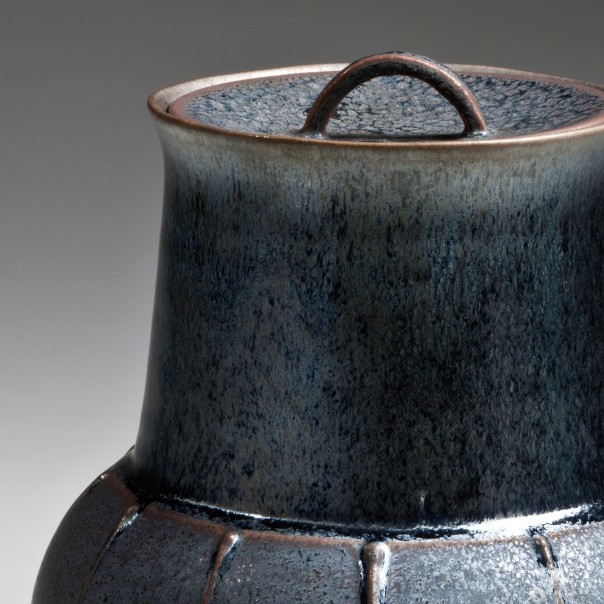 glazed water jar with semi-globular base, flaring neck, and recessed lid with arched handle 