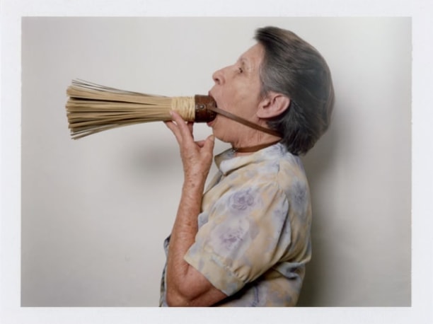 Woman with broom by Benjamin Fredrickson