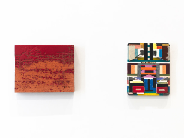 closeup of two artworks, on the left is a rectangular ceramic glazed with textured red patterning and on the right is a colorful painting with glazed ceramic attachments