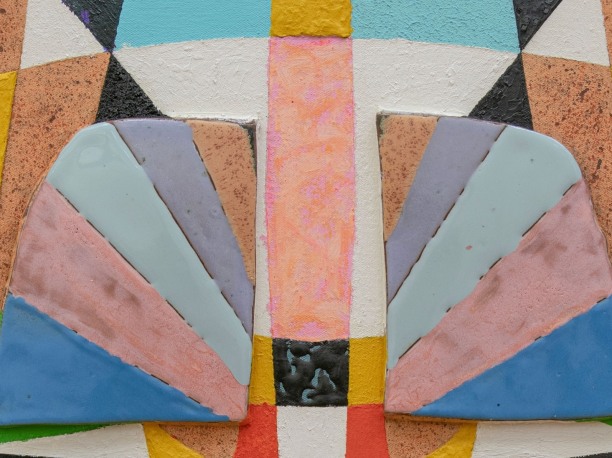 portion of a mixed media artwork consisting of colorful ceramic and paint 