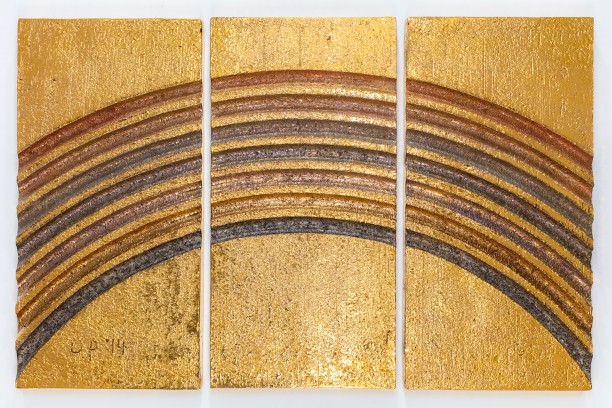 large ceramic triptych with a rainbow pattern in gold and and metallic glazes