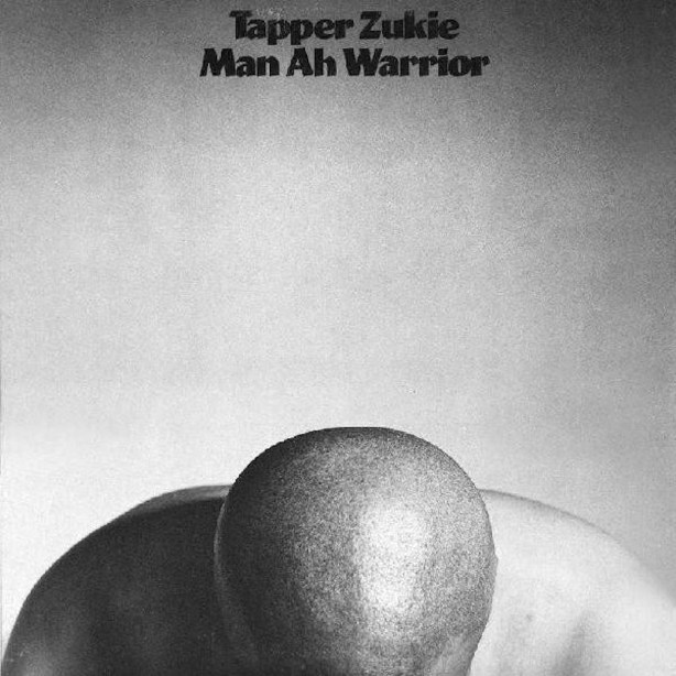 Cover of Tapper Zukie's album Man Ah Warrior, (a man's head and shoulders at the bottom of the frame against a gray background).