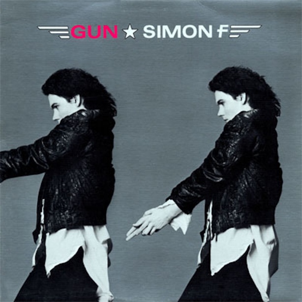 Album cover for Simon F's Gun, Double portrait of Simon standing against a gray backdrop with his fingers pointed like a gun.