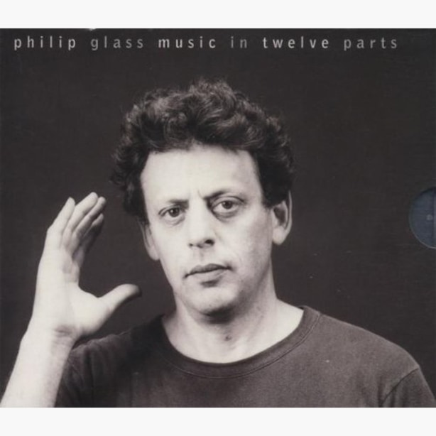 Philip Glass Music in Twelve Parts album cover, with portrait of Philip Glass looking at camera and holding his hand up next to his head.