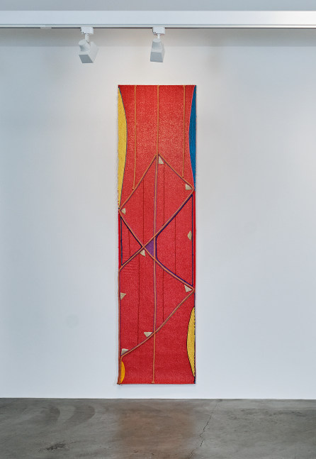 Teresa Baker Signal, 2023 Yarn, parfleche, and willow on artificial turf 106 x 27 inches 269.2 x 68.6 cm