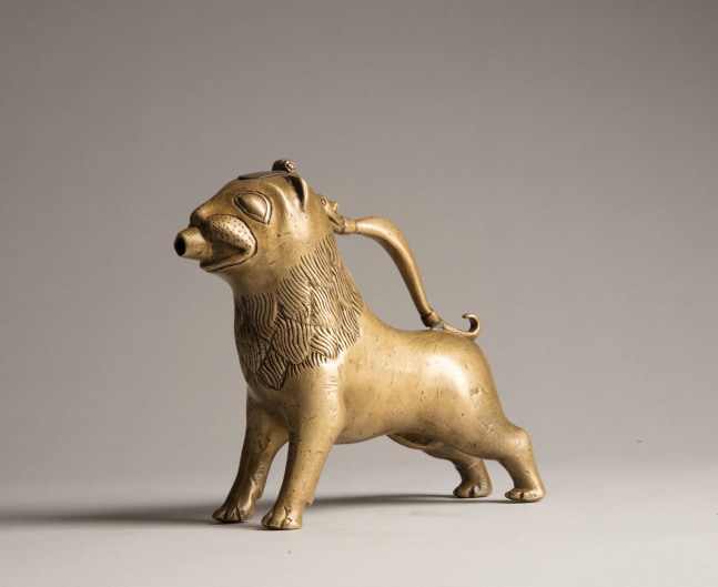 An aquamanile in the form of a lion, Early 13th century
Germany, probably Lower Saxony
Cast copper alloy with fine soldered repairs to the handle at its upper and lower connecting points; hairline fractures to the legs in two places; the hinged lid a modern replacement
6 3/4 x 9 1/8 x 2 1/8 inches
(17.1 x 22.9 x 5.5 cm)
