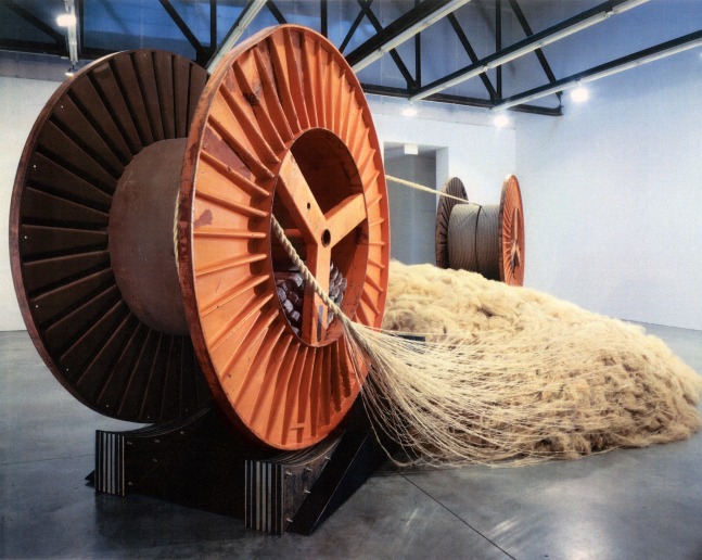 Janine Antoni
To Draw a Line, 2003
4000 lbs&amp;nbsp;of raw hemp fiber
120 feet of hand-made hemp rope spliced into 1200 feet of machine-made hemp rope
2 recycled steel reels
140 lead ingots with a total weight of 13,300 lbs
2 steel ramps with a 20&amp;deg;&amp;nbsp;incline
4 steel and rubber laminated chocks
420 x 240 x 120 inches (1066.8 x 609.6 x 304.8 cm)