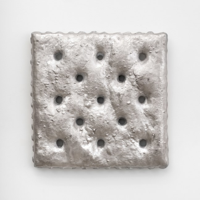 A large aluminum cast saltine cracker mounted to the wall