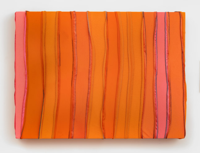 A rectangular painting made from orange and coral durags sewn into vertical stripes.