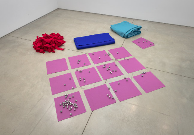 Installation view of A- (Red, Green, Blue, Purple, Felt, Steel, Bought, Cut, Folded, Placed, Rolled), 1966