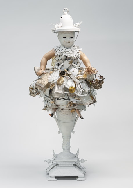 Karin Broker  Wearing the white hat girl, 2020 composite materials, metal, ceramics, glass, doll shoes, wire, cast metal base 30 x 12 x 10 inches stone pedestal: 40 x 10 x 10 inches (KB-272)     $25,000