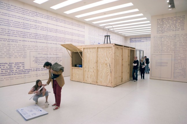 untitled 2005 (the air between the chain-link fence and the broken bicycle wheel), 2005
glass and stainless-steel structure with transmitter, wooden structure with receiver, furniture, monitors
variable dimensions

&amp;nbsp;