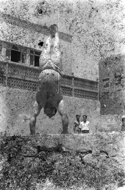 bodybuilders. printed from a damaged negative showing munir el dada in saida, 1948, 2007

inkjet print

70.87 x 57.09 in.