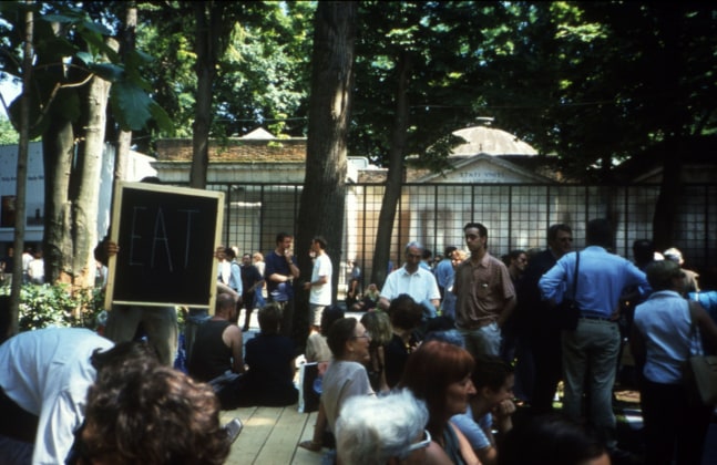 untitled 1999 (royal thai pavilion), 1999
wooden platform, teak tree, chalkboard, chalk, posters, advertisements, envelopes, invitation cards, flags, performance schedule
variable dimensions

&amp;nbsp;