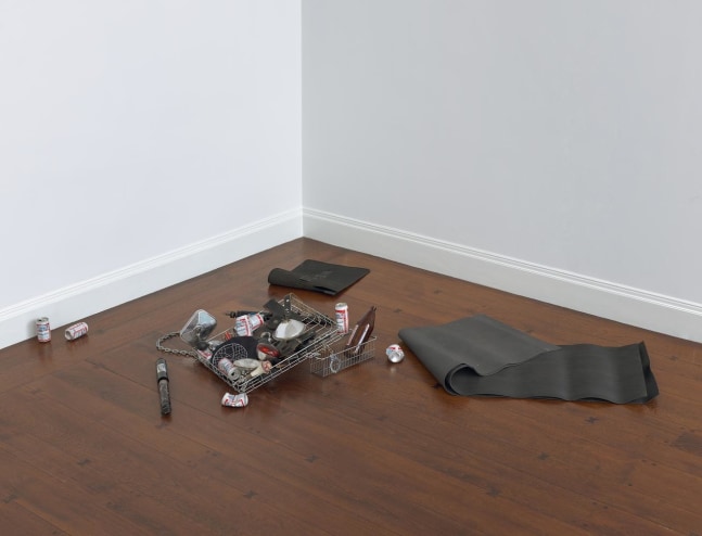 Cady Noland
Bloody Mess
1988
carpet, rubber mats, wire basket, headlamp, shock absorber, handcuffs, beer cans, headlight bulbs, chains and police equipment
dimensions variable