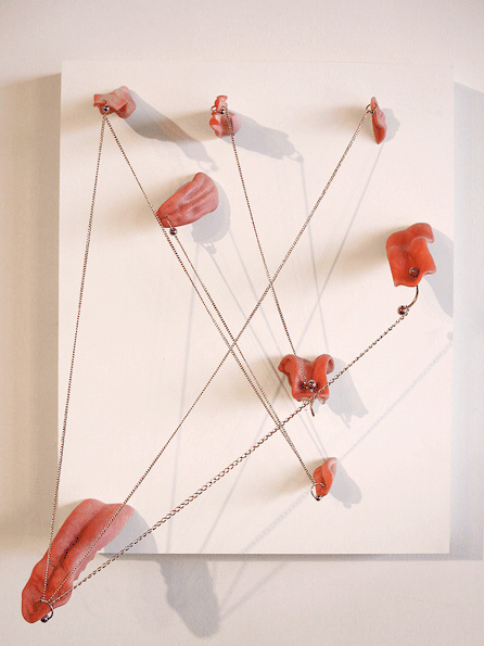 Tongue Tied 5, Cast rubber, nickel-plated rings and chains on wood panel. 11 x 12 x 5.5 inches