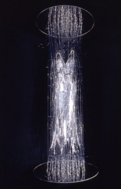 E.V. Day. Transporter, 2000. Silver sequin dress with monofilament, turnbuckles and mirrored disks. 115 x 48 x 48 in. Collection of Heather and Tony Podesta, Falls Church, VA. Courtesy of the artist.