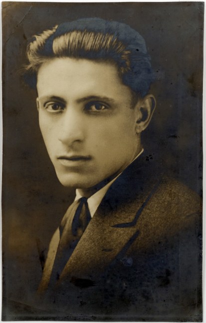 Professional portrait of a three-quarter view of a young man in a wool suit