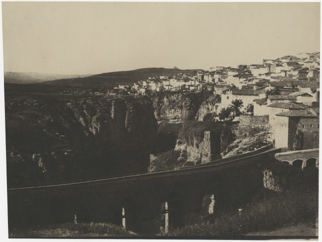 John Beasley GREENE (American, born in France, 1832-1856) El-Kantara Bridge, Constantine, Algeria*, 1855-1856 Lightly coated salt print from a paper negative 22.5 x 30.3 cm on 22.8 x 30.3 cm paper Inscribed &quot;Constantine&quot; in pencil on verso