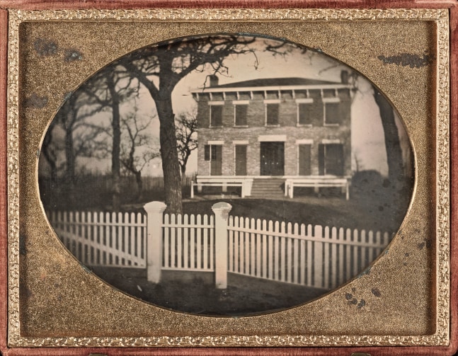 UNKNOWN AMERICAN PHOTOGRAPHER House behind a picket fence, 1850s Quarter plate daguerreotype in a thermoplastic Union Case