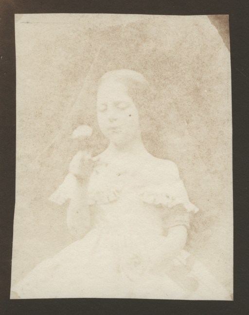 William Henry Fox TALBOT (English, 1800-1877) Portrait of Ela Theresa Talbot, contemplating a rose, circa 1843-1844 Salt print from a calotype negative 8.9 x 6.8 cm on 11.7 x 9.3 cm paper