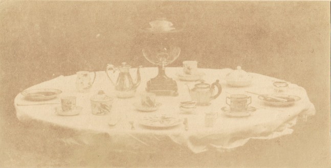 William Henry Fox TALBOT (English, 1800-1877) Table set for tea, 1841-1842 Varnished salt print from a calotype negative 8.5 x 16.8 cm mounted on card, ruled  &quot;Patent Talbotype Photogenic Drawing&quot; label on mount verso