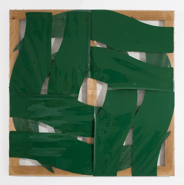 intersecting green swatches of color forming a circular pattern on transparent plastic stretched over a wood stretcher