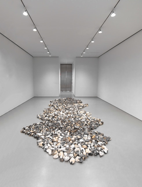 floor sculpture made of pieces of flint installed in a gallery