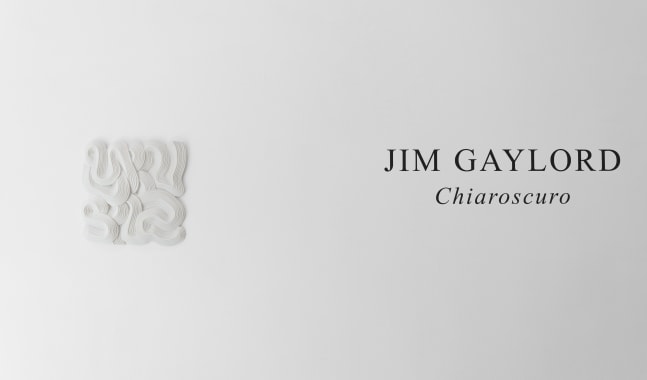 Installation view of a white artwork on the left and the title of the exhibition, &quot;Jim Gaylord: Chiaroscuro&quot; on the right