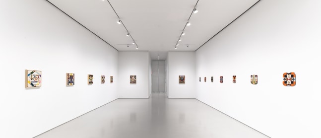 installation view of Umaña hybrid paintings and ceramic tablets hung in a white gallery space