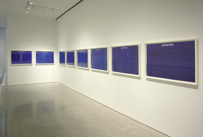 installation view of 8 framed blue works on paper