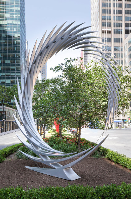 An installation shot of Santiago Calatrava's sharp, reflective and angular stainless steel sculpture sits atop pedestal on Park Avenue.