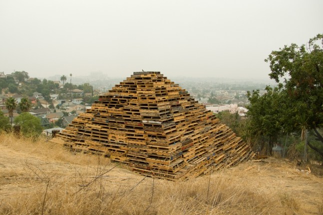 III, 2010, reclaimed wooden pallets, 16 x 27 x 27 feet