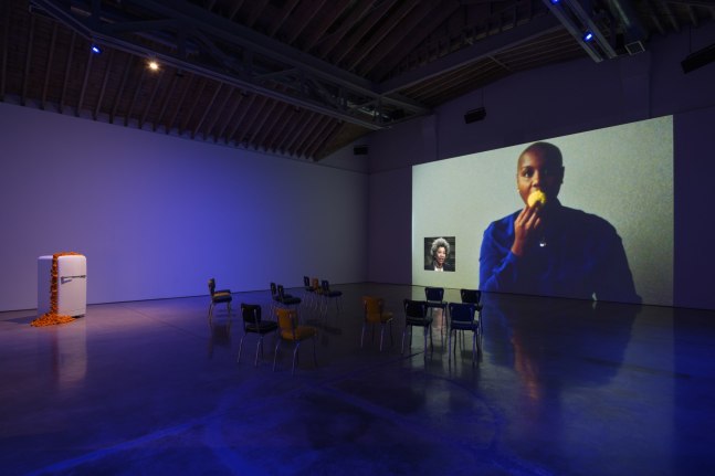 Ja&amp;#39;Tovia Gary
Quiet as it&amp;#39;s kept, 2023
single channel video installation, 26 minutes, 16:9 aspect ratio, stereo sound; Admiral refrigerator with dried marigolds; 16 diner chairs
overall dimensions variable
refrigerator: 56 x 28 x 28 in. (142.2 x 71.1 x 71.1 cm)
16 chairs, each: 32 x 20 x 18 in. (81.3 x 50.8 x 45.7 cm)
Edition of 5, 2AP