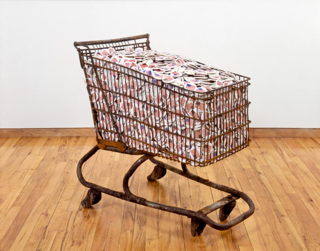 Hans Haacke "Collateral" 1991 Shopping cart with silkscreened metal buttons 33 x 37 1/2 x 20 1/2 in.