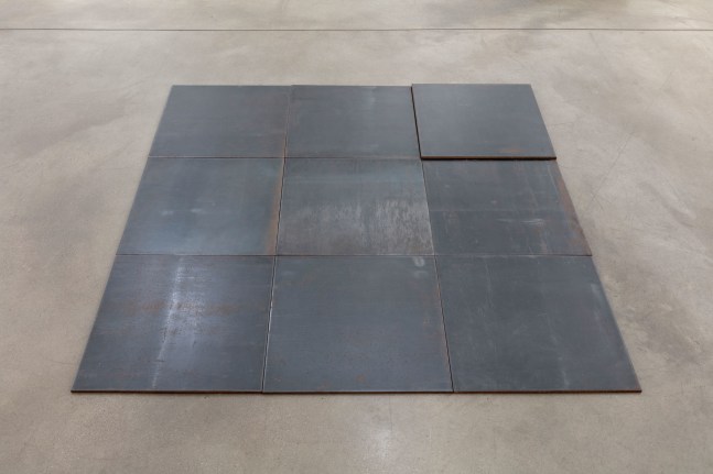 Carl Andre North-East Deck, Glarus, Switzerland 1993 hot-rolled steel 10 units: 9-unit square (3 x 3) on floor with tenth unit superimposed on north-east unit each: 1/4 x 19 3/4 x 19 3/4 in. (.6 x 50.2 x 50.2 cm) overall: 1/4 x 59 x 59 in. (.6 x 149.9 x 149.9 cm)