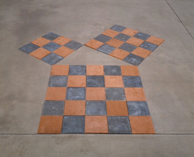 Carl Andre "The Void Enclosed by Lead & Copper Squares of Three, Four, & Five" 1998 25 copper plates & 25 lead plates Overall 3/8 x 87 x 80"
