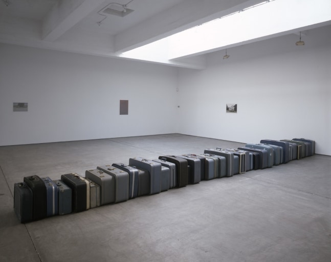 Zoe Leonard "1961" 2003 Vintage suitcases, 42 pieces 22 x 30 ft