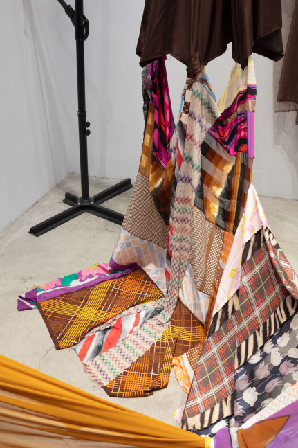 Eric N. Mack Landlord (detail), 2021 umbrella, wood flagpoles, metal brackets, fabric collage, thread dimensions variable
