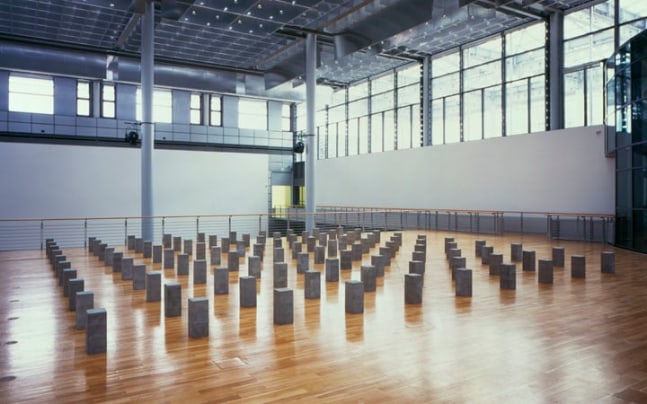 Carl Andre "Lament for the Children" 1976/96 Concrete blocks (100 units) 18" x 36'8" x 36'8" overall