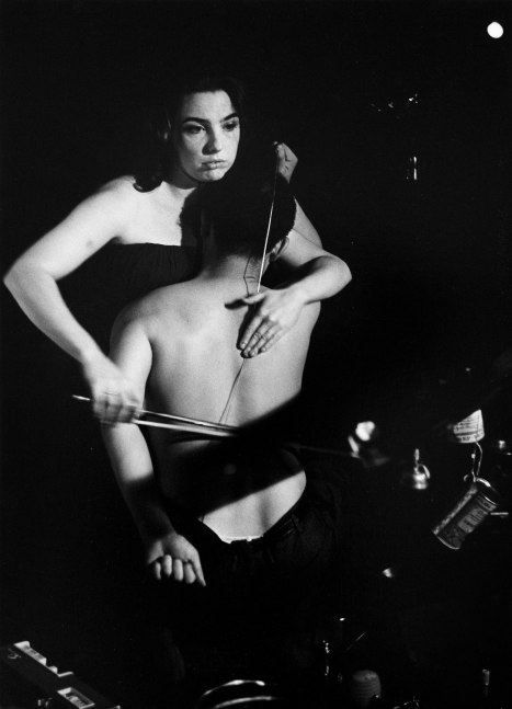 Charlotte Moorman and Nam June Paik Performing John Cage's 26'1.1499" for a String Player, 1965 gelatin silver print mounted on gatorboard