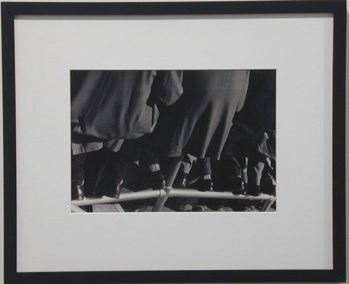 Lisette Model "Belmont Park Race Track (men seated on metal fencing)" 1956 Gelatin silver print 9 1/2 x 12 1/2 in.