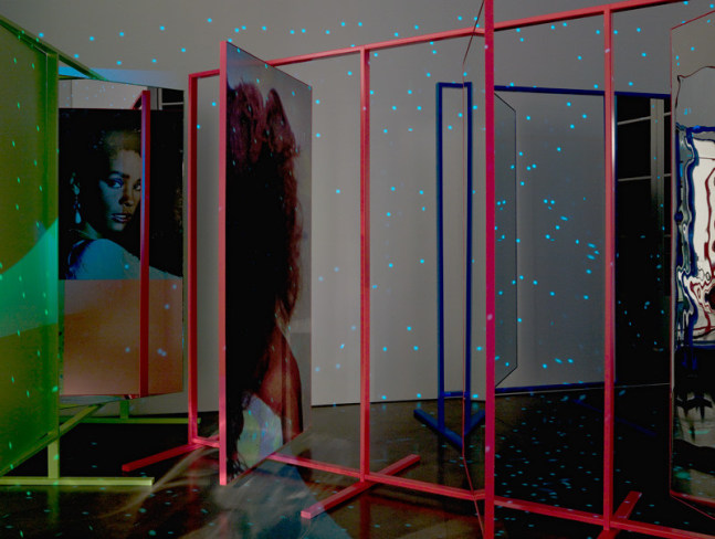 Kelley Walker "Whitney Houston" 1984-85, 2008 aluminum stands, mylar, mirror,Epson prints , disco ball with chain, sound and video projection. dimensions variable