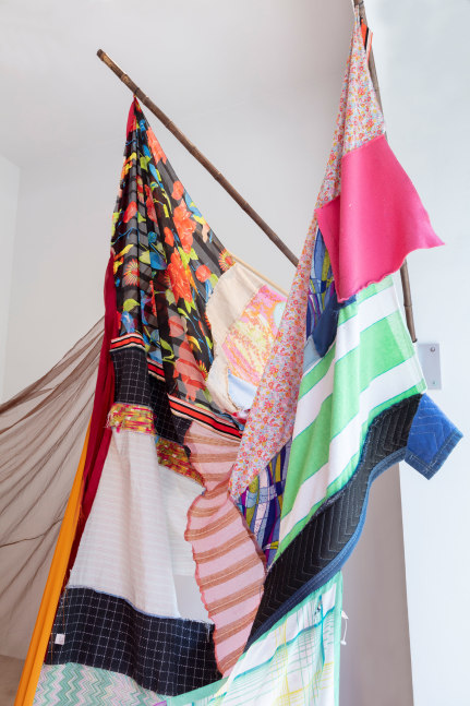 Eric N. Mack Landlord (detail), 2021 umbrella, wood flagpoles, metal brackets, fabric collage, thread dimensions variable