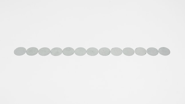 Carl Andre 13 Part Galvanized Steel Disc Row, 2016 galvanized steel 13 elements, each: 1/32 x 1 5/8 in. (.1 x 4.1 cm) overall: 1/32 x 1 5/8 x 21 1/4 in. (.1 x 4.1 x 54 cm)
